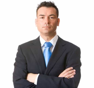 man in suit with arms crossed